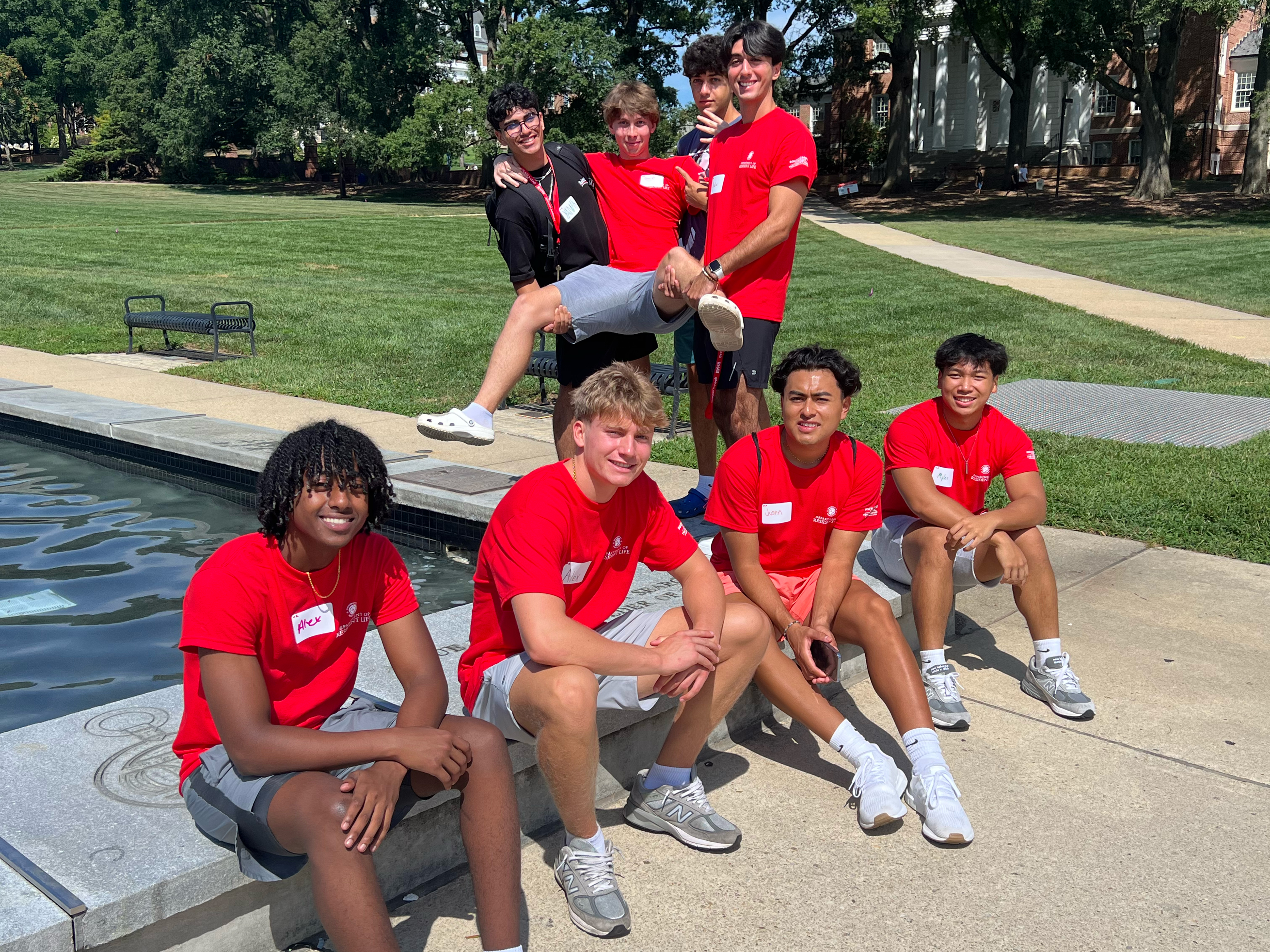 Students pose at the ODK Fountain on McKeldin Mall as part of the BioFIRE scavenger hunt. 