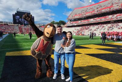 Testudo posing with Hallie Pennington and Collin Vincent after they got engaged at SECU Stadium
