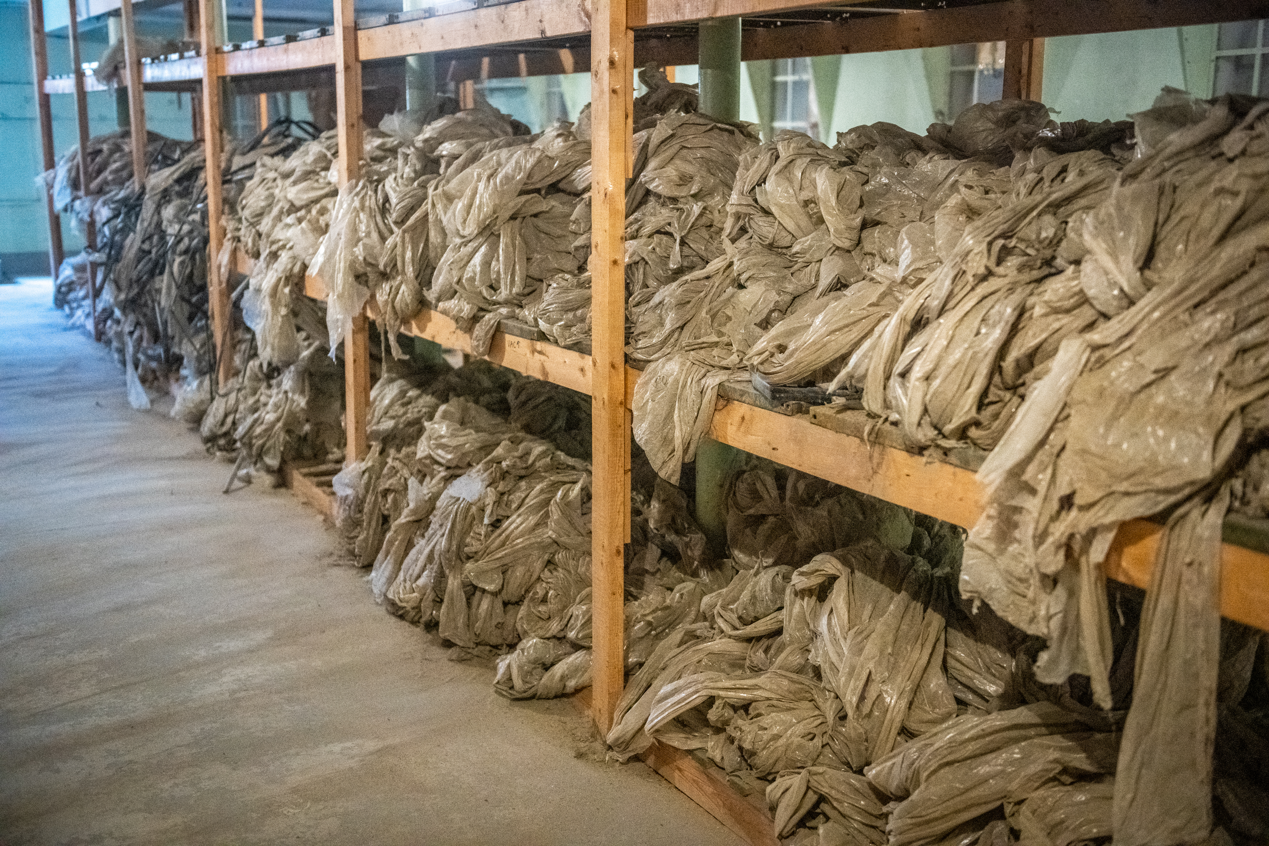 Heaps of plastic waste on storage shelves