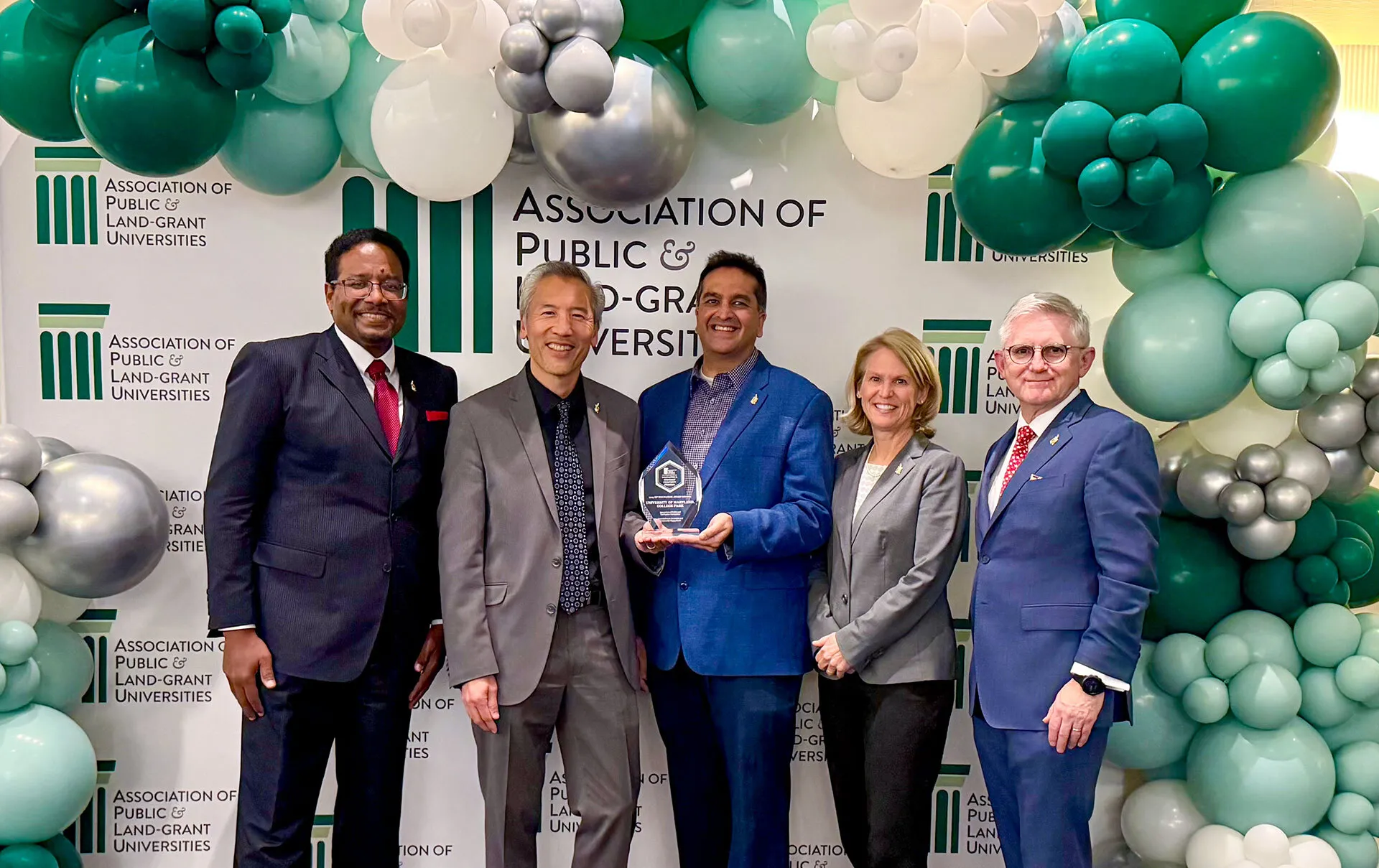 From left, UMD President Darryll J. Pines, Chief Innovation Officer Dean Chang, Innovation & Entrepreneurship Ecosystem Catalyst Sammy Popat, Senior Vice President and Provost Jennifer King Rice and Vice President for Research Patrick O'Shea accept the Association of Public and Land-grant Universities’ 2025 Innovation & Economic Prosperity Innovation Award.