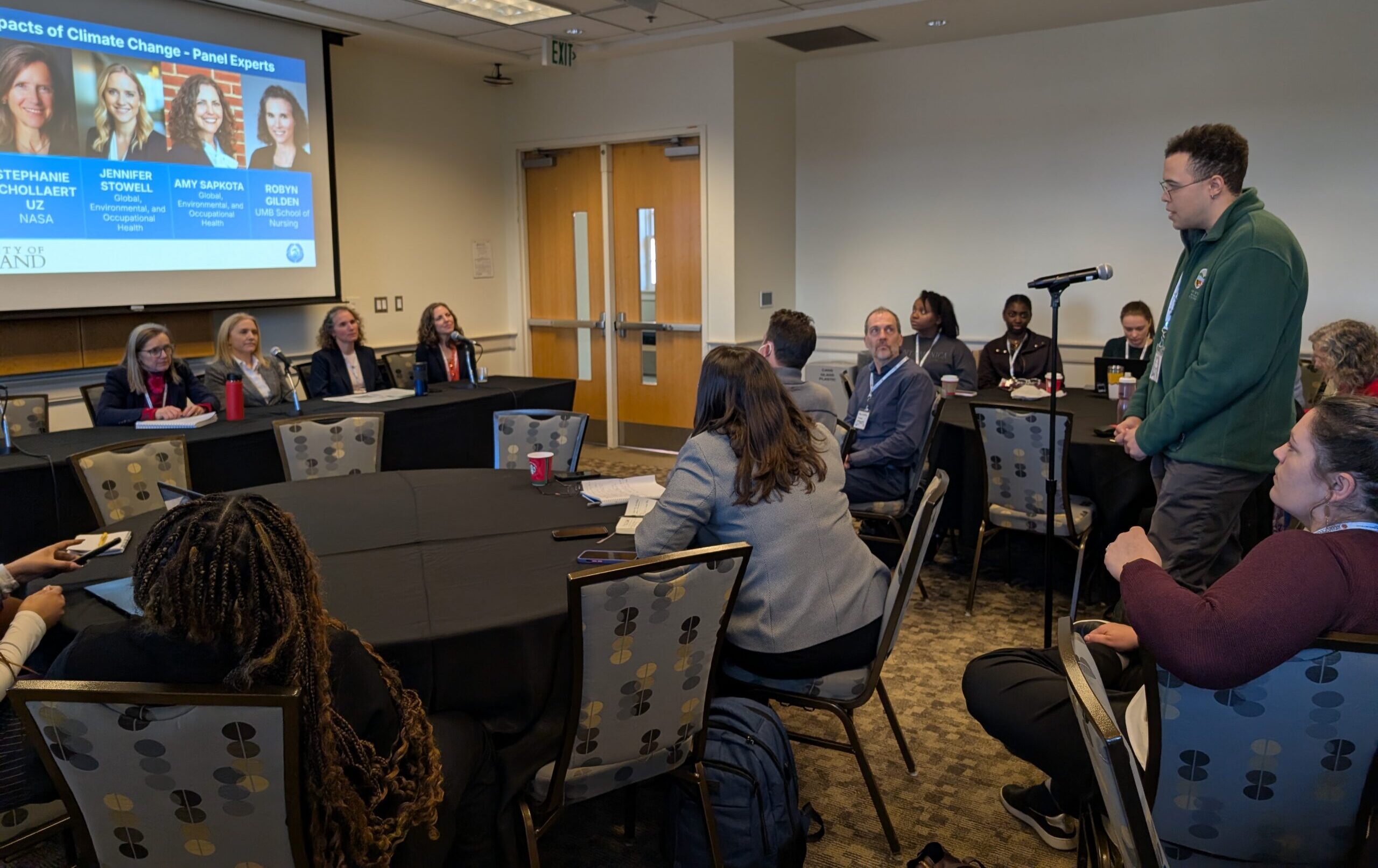 An audience member poses a question to the Health Impacts of Climate Change panel. 