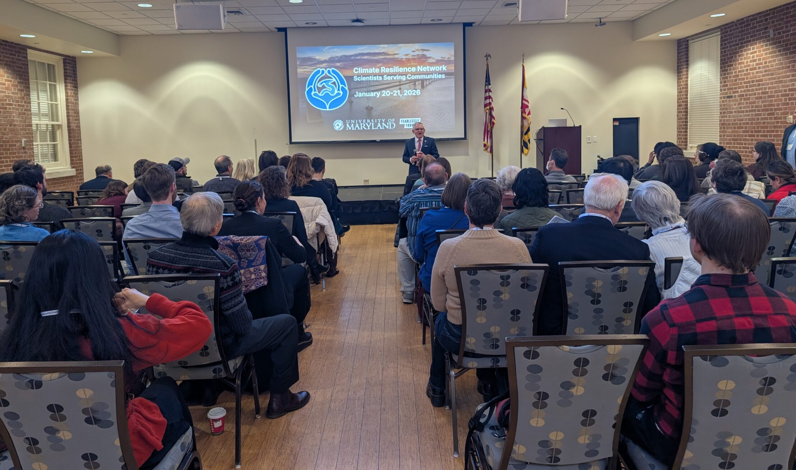 Pat O'Shea welcomes the audience to the university of Maryland