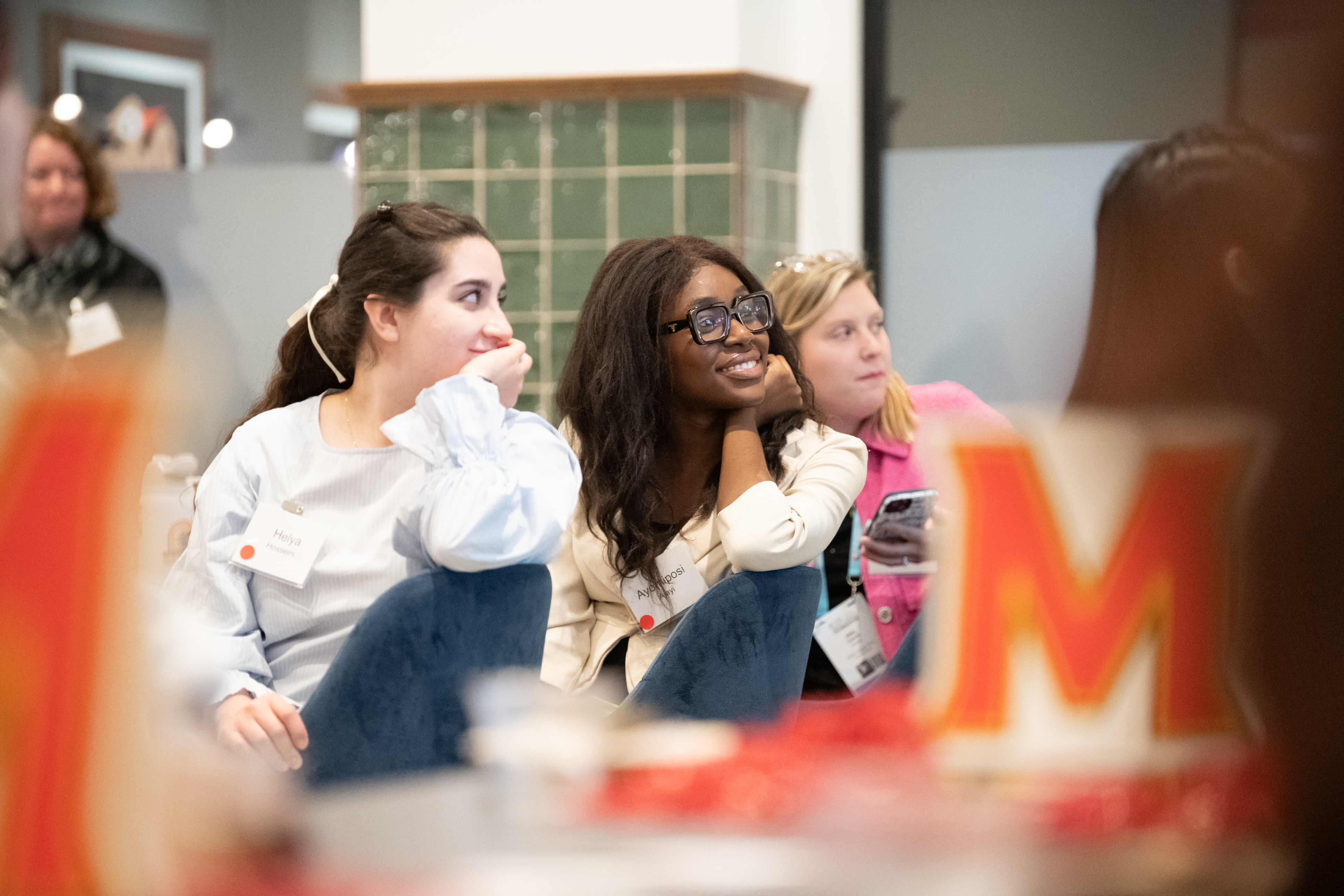 People listening to speakers at Terps in Tech alum event at the Grace Hopper Celebration