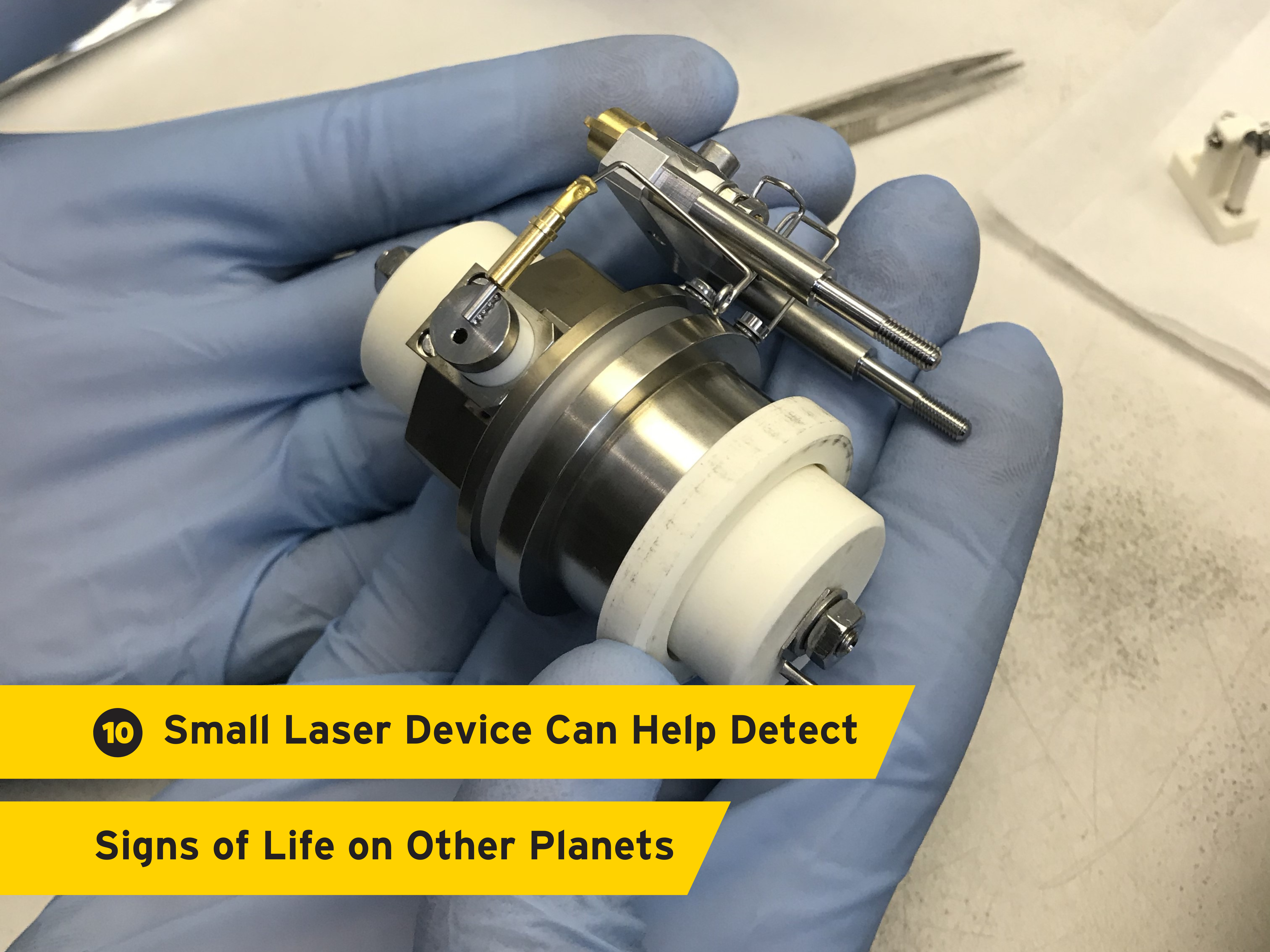 "New Small Laser Device Can Help Detect Signs of Life on Other Planets" over a background showing the laser device held in gloved hands