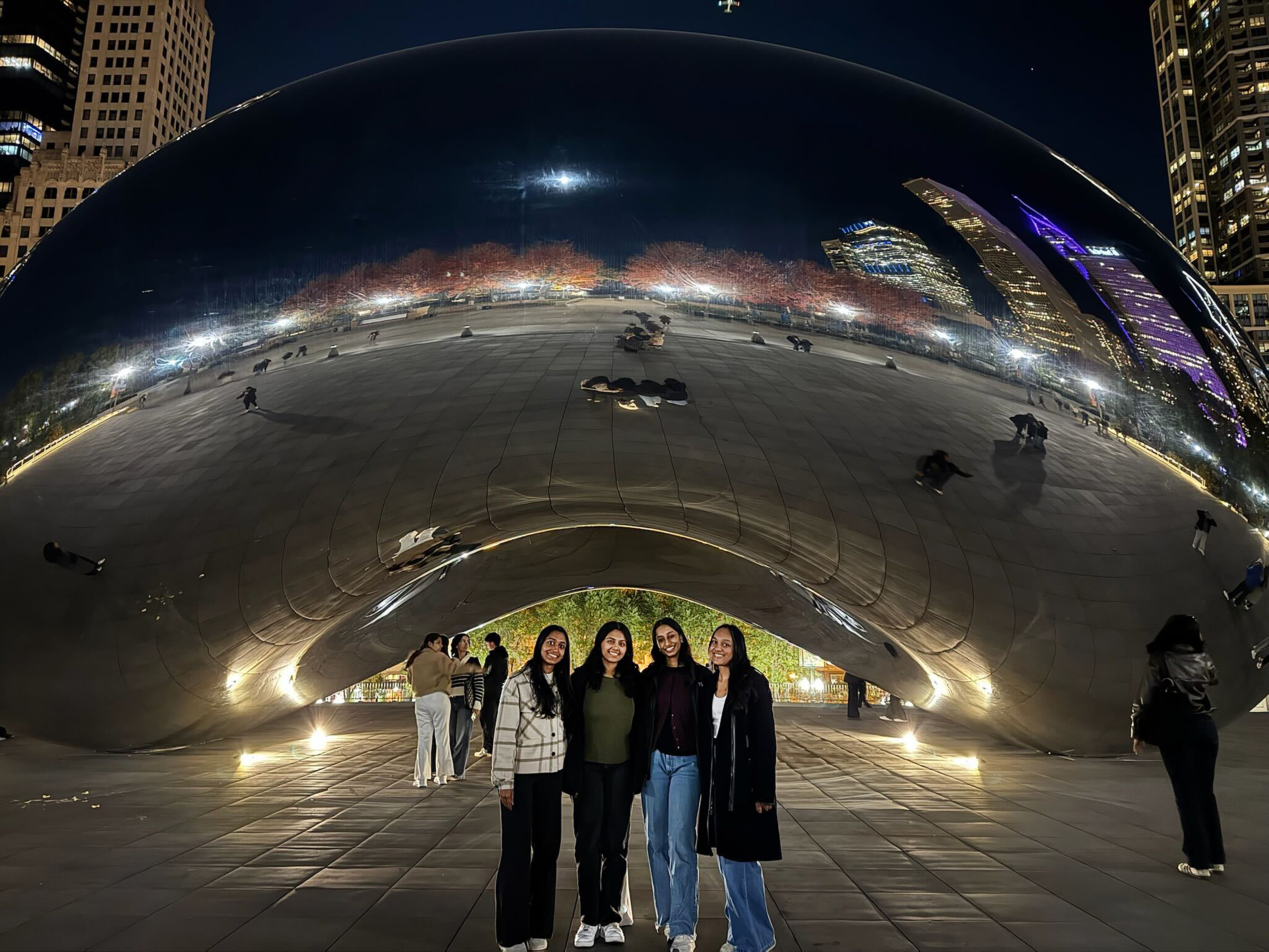 Group of four students in front of Chicago's iconic Cloud Gate