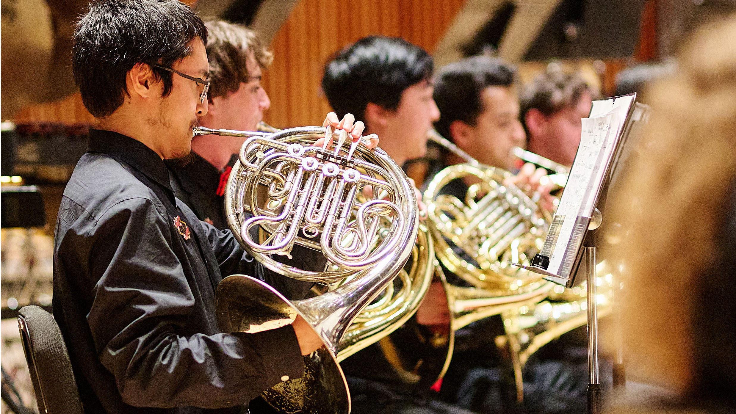 Musicians playing the French horn.