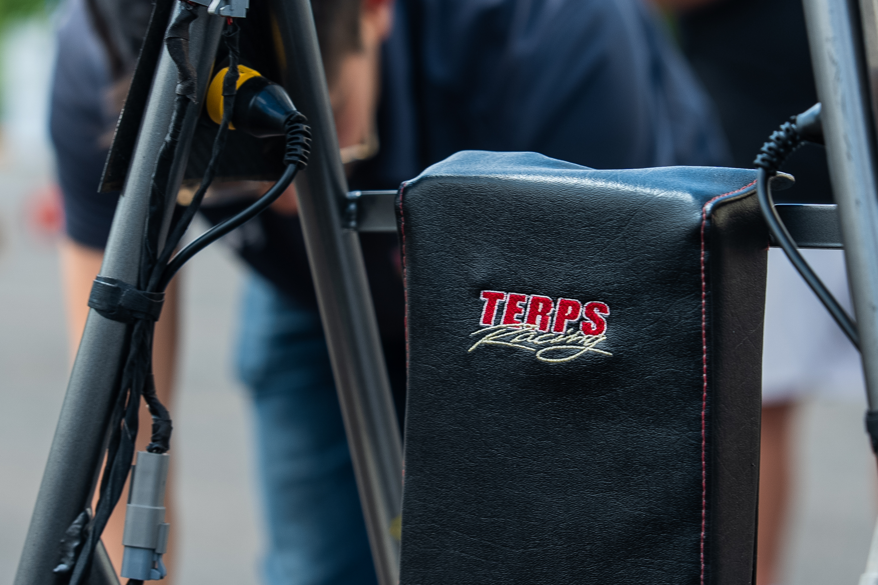 Close-up of the headrest of the car, which has the team's logo embroidered in it.