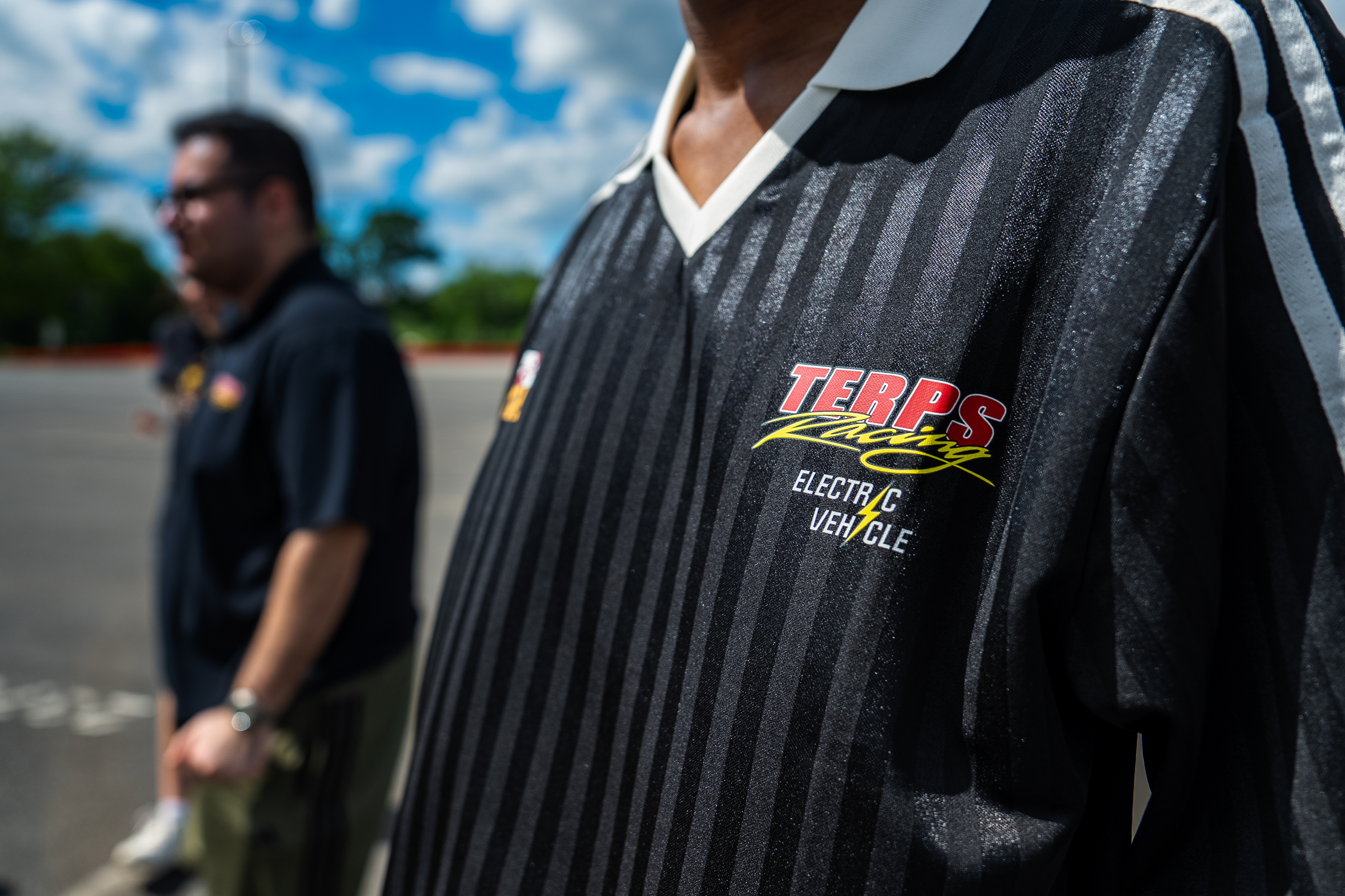 Close-up of a student's jersey with the Terps Racing Electric Vehicle logo. 