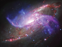 Two extra spiral arms that glow in X-ray, optical and radio light are seen in this composite image of Galaxy NGC 4258. The supermassive black hole at the center of NGC 4258 is about 10 times larger than the one in the Milky Way and is consuming material at a faster rate, potentially increasing its impact on the evolution of its host galaxy. Credit: NASA/CXC/JPL-Caltech/STScI/NSF/NRAO/VLA