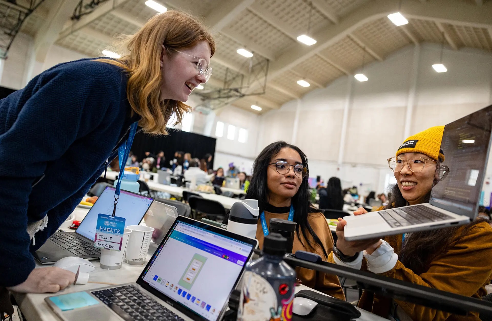 From left, Josie Daw, Khloe Pointer, Yena Paek and Anna Pincus (not pictured) work on an app called “Listings” to help people find housing in an easy and accessible way. Daw participated in Technica virtually in the past and traveled from South Korea for this year’s event.