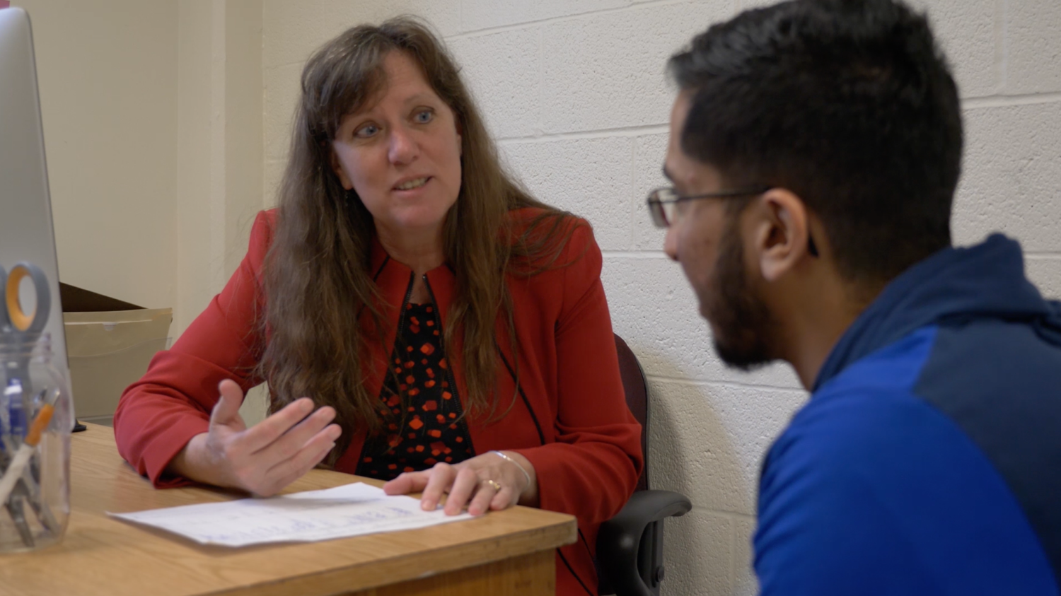 Kaci Thompson talking to a BioFIRE student