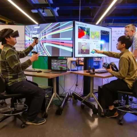 Researchers with VR headsets