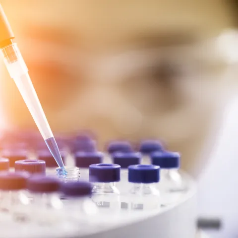 Stock image of a person pipetting up close