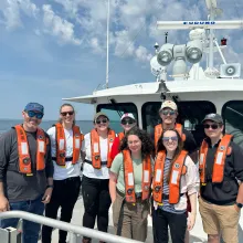 AOSC students and faculty on bow of research vessel