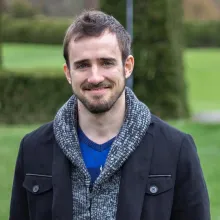 Brian Calvert in front of green background