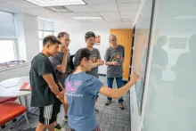 Solving math problems at the whiteboard