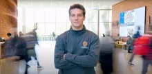 Hayden Earlewine wearing a gray CMNS quarter zip
