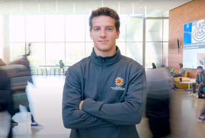 Hayden Earlewine wearing a gray CMNS quarter zip