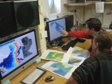 scientists look for suitable sample site using data of seamounts collected with sonar