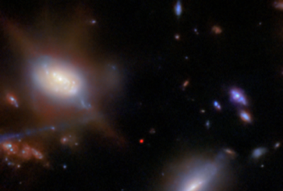 The red dot in the center is the galaxy JADES GS-z13-1, which existed very early in the universe. The JWST observed the galaxy as it existed approximately 13.5 billion years ago, just 330 million years after the big bang. 
