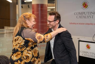 Jan Plane with her hand on Brendan Iribe's shoulder