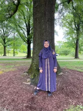 Muntaha Hossain standing in front of a tree