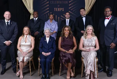 Vice President for University Relations Jim Harris (far left) and Alumni Association Board of Governors President Bert D. Williams '96 and UMD President Darryll J. Pines (far right) flank the 2025 honorees of "A Celebration of Terps." Back row, from left: Margot Thomas '90, Omar Tarabishi ’13, M.A. ’20 and Kevin J. Tu ’23, ’23. Front row: Alumni Association Executive Director Jessica Roberts, Rita R. Colwell, Dawn Flythe Moore '97 and Jackie Cardello ’93.