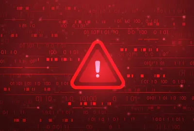 Red caution sign surrounded by binary code