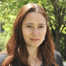 Outdoor portrait of brunette woman, Dr. Allison Coffin.