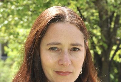 Outdoor portrait of brunette woman, Dr. Allison Coffin.