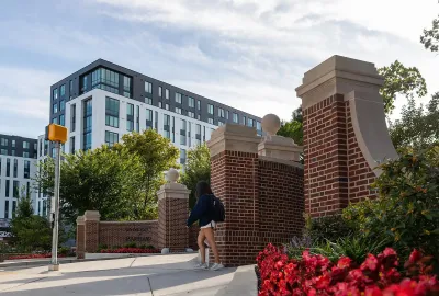 Route one entrance to campus with apartments in the background