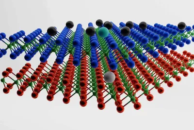 two layers of a chemical structure lie above each other with black balls hovering on top. On the top layer, there is a cyan ball with a white ball in the corresponding layer below