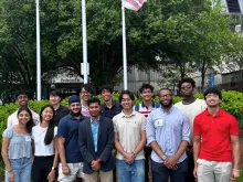 A group of University of Maryland students standing outside a building.