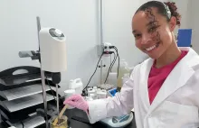 Kaia Ungerer posing in a chemistry lab