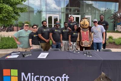 Microsoft team posing with Testudo in front of the Iribe Center in May 2025
