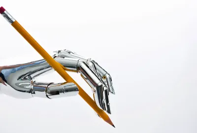 Robot hand holding a pencil