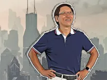 An Illustration of Zhanqing Li standing with his hands on his hips. A smoggy city is in the background.