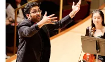 Conductor conducting on stage. Credit: Ken Rubin