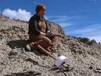 gussie mccracken sitting on a rock