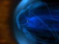 A giant magnetic field (swirling blue lines) surrounds Earth. As Earth travels through solar wind (orange area), its magnetic field creates a bow shock in front of itself (pale blue area). Image: NASA/Goddard Space Flight Center 