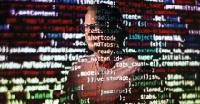 Hal Daume III with computer code in front of his face