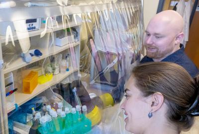 Brantley Hall and a Student Working at a flexible vacuum chamber. Credit: Lisa Helfert.