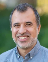 Carlos Machado headshot