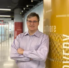 Mihai Pop leaning against a column