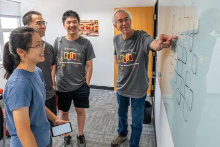 Professor Larry Washington works with students attending the first year of the Brin Maryland Mathematics Camp in 2024