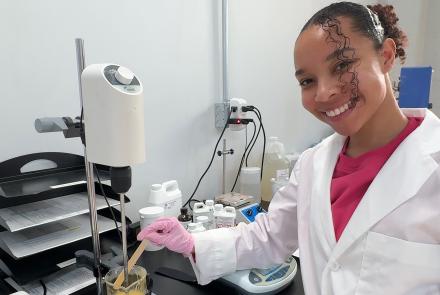 Kaia Ungerer posing in a chemistry lab