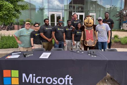 Microsoft team posing with Testudo in front of the Iribe Center in May 2025