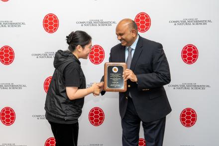 Dean Varshney presenting TA award to Mengting Chao