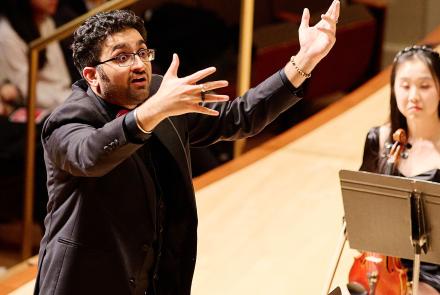 Conductor conducting on stage. Credit: Ken Rubin