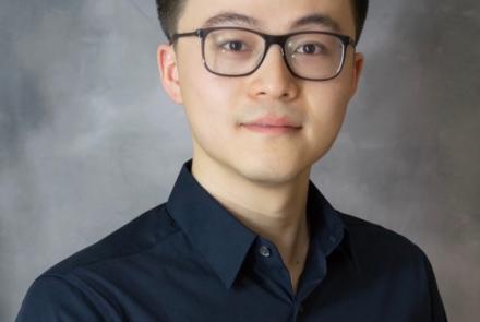Assistant Professor in Computer Science Ruohan Gao in dark shirt and glasses.